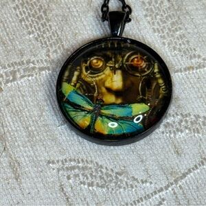 Mechanical or Scientist face and blue butterfly/moth necklace.‎ 24”